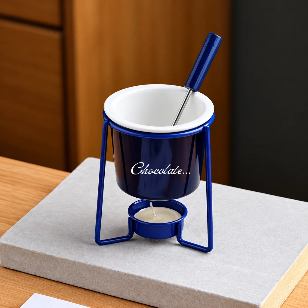 Blue ceramic chocolate fondue bowl on a metal stand with tealight and dipping fork