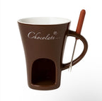 Brown ceramic chocolate warmer mug with built-in candle chamber and dipping fork