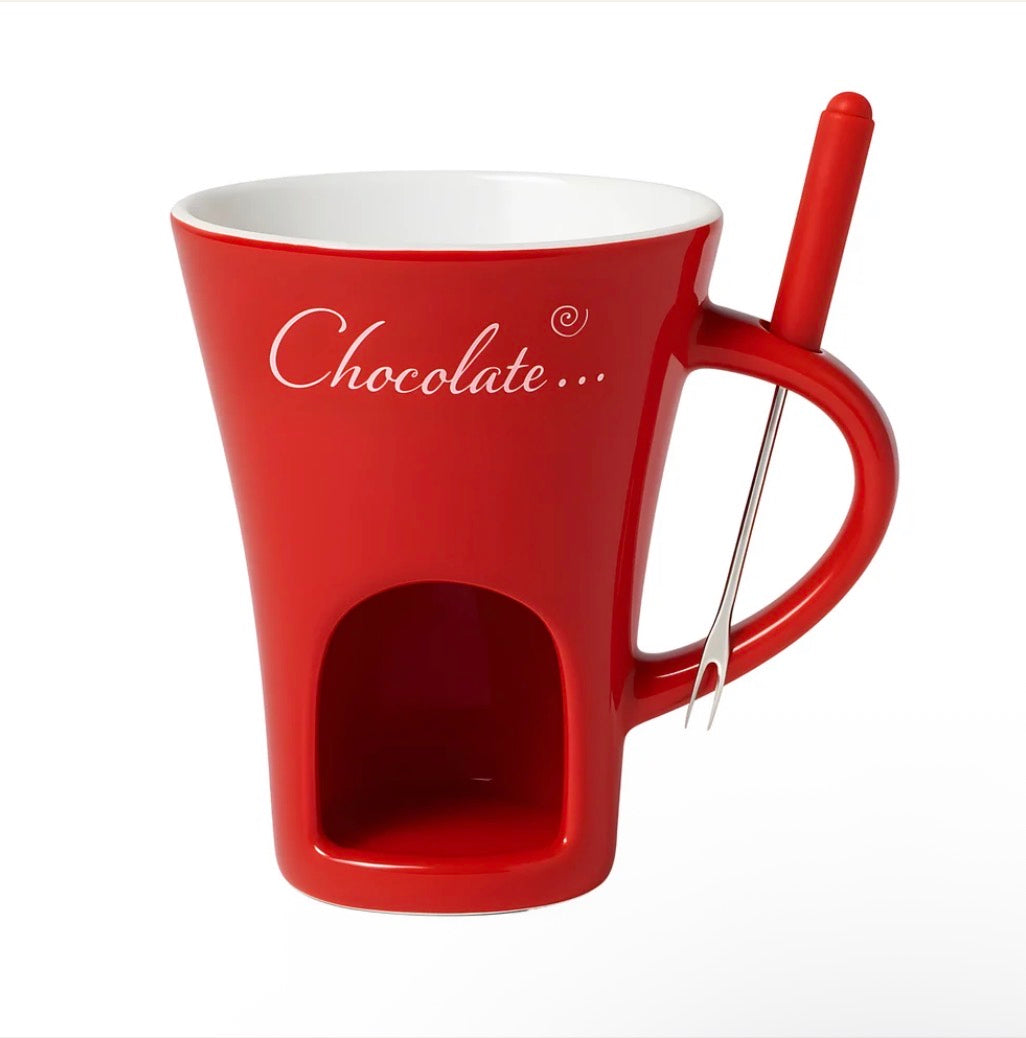 Red ceramic chocolate warmer mug with built-in candle chamber and dipping fork